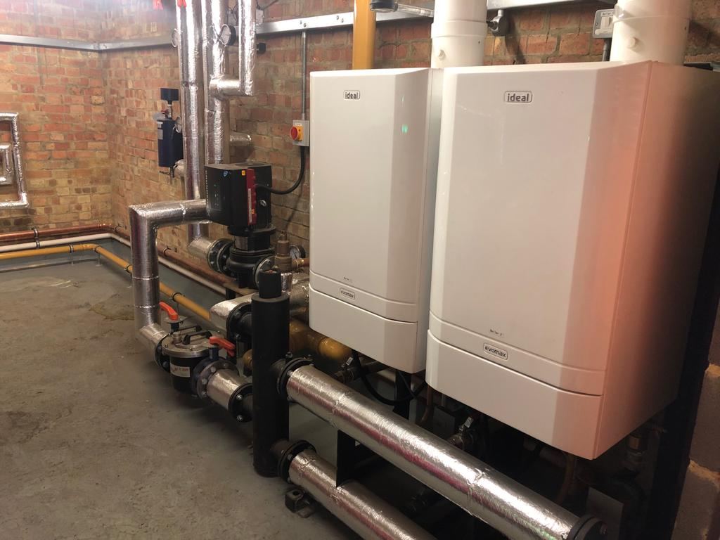 Commercial boilers and pressurisation vessels in a plant room